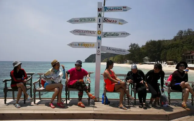 Tourists sit as they wait for their boat at Maiton Island in Phuket, Thailand March 18, 2016. (Photo by Athit Perawongmetha/Reuters)