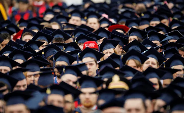 A graduate wears a Make America Great Again hat amidst a sea of mortar boards before the start of commencement exercises at Liberty University in Lynchburg, Virginia, U.S., May 11, 2019. (Photo by Jonathan Drake/Reuters)