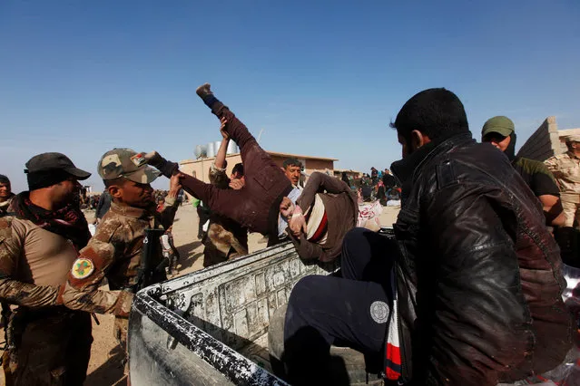 Iraqi Special Operations Forces arrest a person suspected of belonging to Islamic State militants in western Mosul, Iraq, February 26, 2017. (Photo by Alaa Al-Marjani/Reuters)