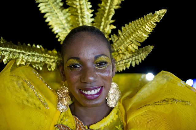 Carnival Queen Claire Platel smiles for the camera during Carnival celebrations in Les Cayes, Haiti, Tuesday, February 28, 2017. Haiti's government spent some $3 million on this year's Carnival celebrations, hoping to lure tourists and Haitians living abroad. (Photo by Dieu Nalio Chery/AP Photo)