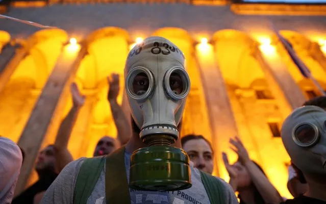 Protester attends a rally against a Russian lawmaker's visit near the parliament building in Tbilisi, Georgia on June 22, 2019. (Photo by Irakli Gedenidze/Reuters)