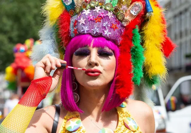 Paraders party on Portland Place at the 2019 Pride parade in London, England, on July 6, 2019. This year marks the 50th anniversary of the 1969 Stonewall riots in New York, an uprising sparked by a police raid on a gay club, the Stonewall Inn, in Greenwich Village. The riots are often seen as the moment that set in motion the modern gay rights movement, in the US and beyond. (Photo by Alamy Live News)