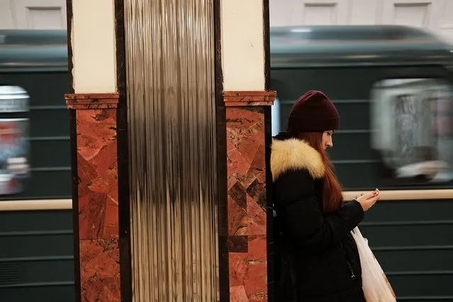 A woman pauses  in the Mayakovskaya metro station on March 3, 2017 in Moscow, Russia. (Photo by Spencer Platt/Getty Images)