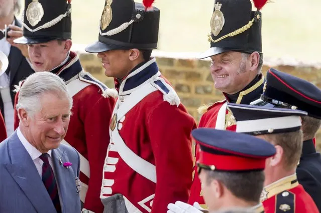 Britain's Prince Charles speak with the troops during a ceremony for the opening of the Hougoumont farm as part of the bicentennial celebrations for the Battle of Waterloo, near Waterloo, Belgium June 17, 2015. The commemorations for the 200th anniversary of the Battle of Waterloo will take place in Belgium on June 19 and 20. REUTERS/Geert Vanden Wijngaert/Pool