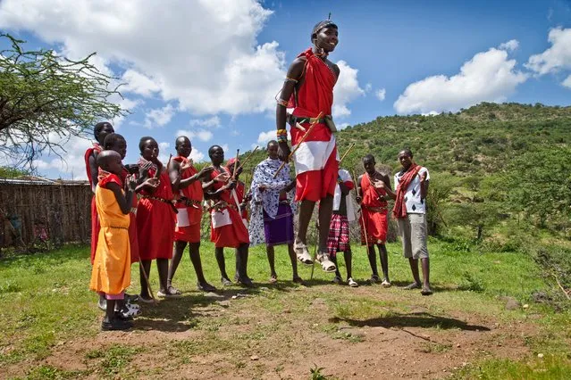 “This was taken in a village near Borana nature reserve in Kenya. We were invited by one of the Masai Mara villagers to observe one of their rehearsals before a coming of age ceremony. Jumping is part of the tribal tradition; the man who jumps the highest gets to choose the bride he would like to marry”. (Photo by Dani Bower/The Guardian)