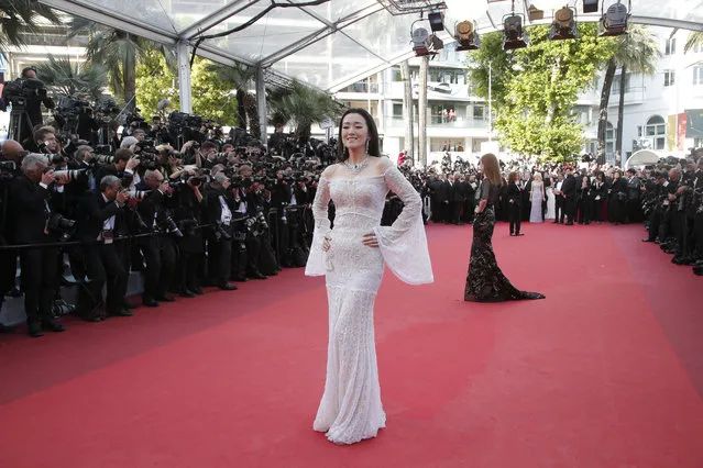 Actress Gong Li arrives on the red carpet for the screening of the film Cafe Society and the Opening Ceremony at the 69th international film festival, Cannes, southern France, Wednesday, May 11, 2016. (Photo by Thibault Camus/AP Photo)