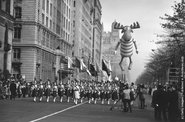 1961:  Americans celebrate Thanksgiving Day in New York. The parade nears Times Square