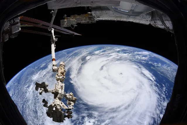 A handout image taken aboard the International Space Station (ISS) and made available by the European Space Agency (ESA) shows Hurricane Ida churning in the Gulf of Mexico ahead of its landfall in Louisiana, USA, 29 Augutst 2021. Hurricane Ida made landfall as a category 4 hurricane on the 16 anniversary of Hurricane Katrina. The image was shared on ESA astronaut and Expedition 65 crew member Thomas Pesquet's Twitter account. (Photo by European Space Agency Handout/EPA/EFE)