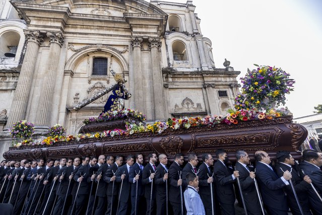 Catholic faithful participate in the “La Resena” procession during Holy Week, in Guatemala City, Guatemala, 04 April 2023. Hundreds of devout Catholics packed the center of Guatemala City to accompany the procession of “La Resena”, a procession with 373 years of history that leaves every Tuesday of Holy Week. (Photo by Esteban Biba/EPA)