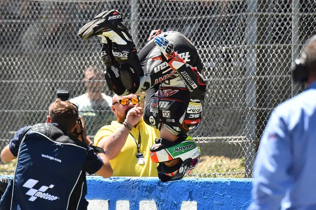 Moto2 rider Johann Zarco (Kalex), jumps to celebrate after winning the Moto2 race as part of the Italian Moto Grand Prix at the racetrack in Mugello on May 22, 2016. (Photo by Giuseppe Cacace/AFP Photo)