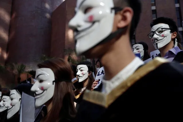 University students wearing Guy Fawkes masks pose during a news conference to support anti-government protests before their graduation ceremony at the Hong Kong Polytechnic University in Hong Kong, China, November 5, 2019. (Photo by Shannon Stapleton/Reuters)