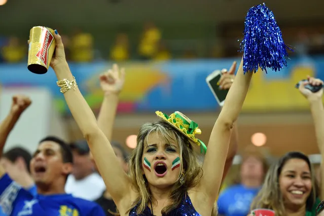 Italy fans cheer on their team during the 2014 FIFA World Cup Brazil Group C match between Cote D'Ivoire and Japan at Arena Pernambuco on June 14, 2014 in Recife, Brazil. (Photo by Stuart Franklin - FIFA/FIFA via Getty Images)