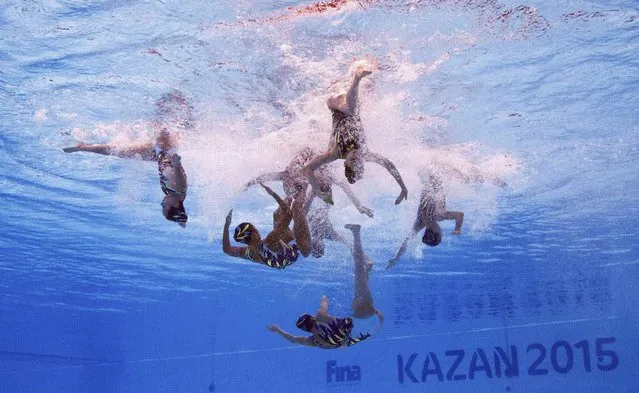 Members of Team Japan are seen underwater as they perform in the synchronised swimming team free routine preliminary at the Aquatics World Championships in Kazan, Russia July 28, 2015. (Photo by Michael Dalder/Reuters)