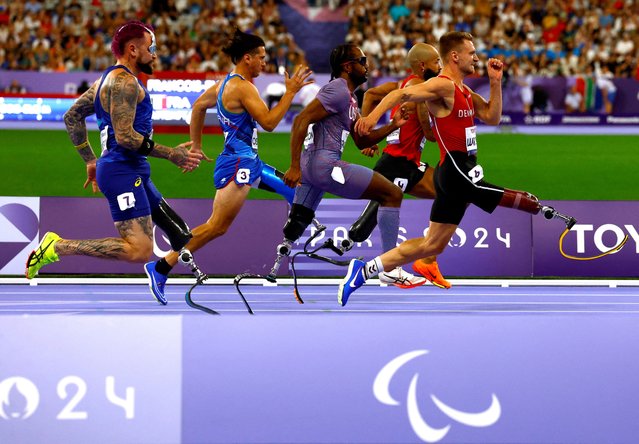 Alessandro Ossola of Italy, Leon Schaefer of Germany Desmond Jackson of United States, Daniel Wagner of Denmark and Vinicius Goncalves Rodrigues of Brazil in action during heat 2 of the men's 100m  T63 Round 1 in Saint-Denis, France on September 1, 2024. (Photo by Thomas Mukoya/Reuters)