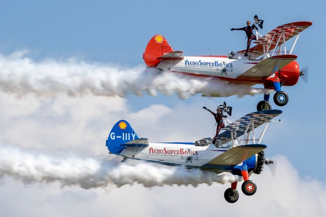 Picture dated June 25th, 2023 shows the Aerosuperbatics Wing Walkers flying at the Duxford airshow in Cambridgeshire, non-metropolitan county in the East of England. (Photo by Martyn Foss/Bav Media)