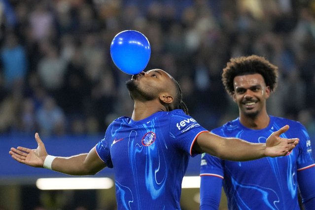 Chelsea's Christopher Nkunku celebrates after scoring his side's fifth goal during the English League Cup third round soccer match between Chelsea and Barrow at Stamford Bridge stadium in London, Tuesday, September 24, 2024. (Photo by Kirsty Wigglesworth/AP Photo)