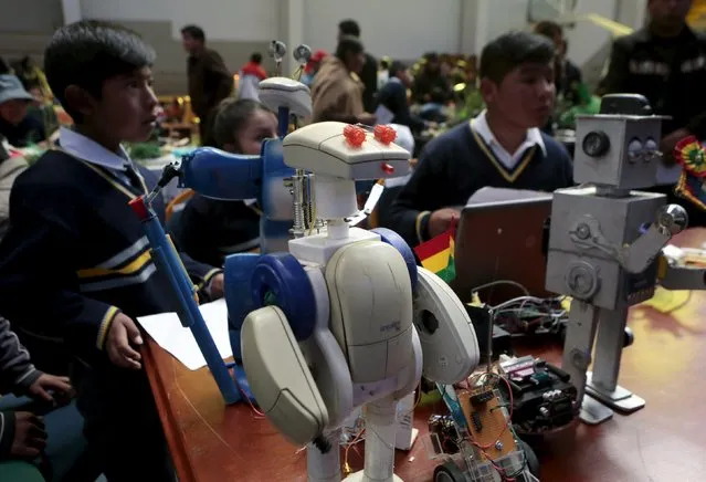 Robots built with recycled materials are seen during the annual robotics fair for students supported by the Bolivian Education Ministry in La Paz, August 10, 2015. (Photo by David Mercado/Reuters)