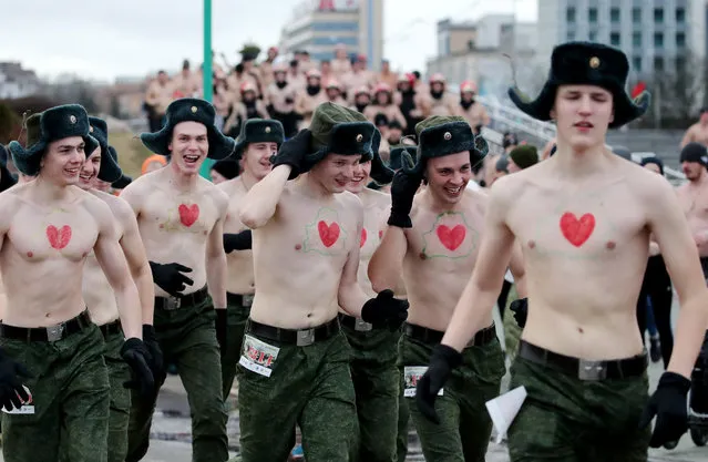 Bare-chested participants run at the “Real men's race” to celebrate the Fatherland's Defender Day in Minsk, Belarus, 23 February 2020. About 2,000 men took part in the competition, local media report. The 23 February is celebrated as the Defender of the Fatherland Day in Russia, Belarus, Kyrgyzstan, and Tajikistan marking the date in 1918 when the first mass draft into the Red Army took place in Moscow and Petrograd during the country's Civil War and war against the German Emperor. (Photo by Tatyana Zenkovich/EPA/EFE)