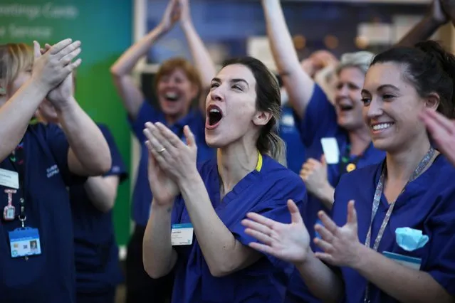 NHS workers applaud outside Chelsea and Westminster Hospital during the Clap for our Carers campaign in support of the NHS as the spread of the coronavirus disease (COVID-19) continues, London, Britain, April 9, 2020. (Photo by Kevin Coombs/Reuters)