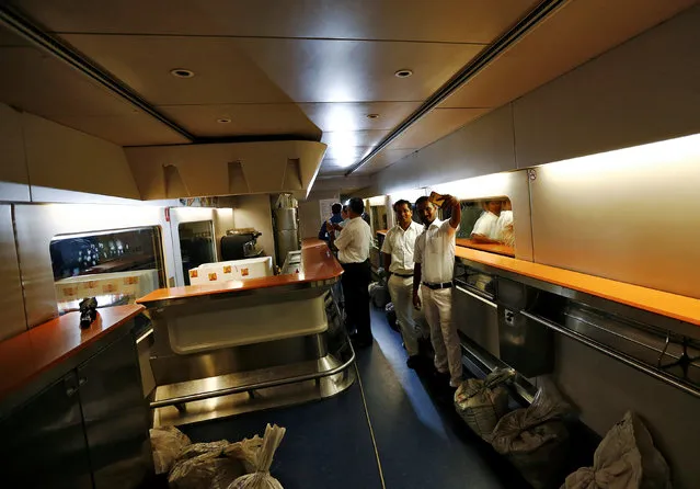 People take pictures inside the parked high speed Talgo train during its trial run at a railway station in Mumbai, India August 2, 2016. (Photo by Danish Ismail/Reuters)