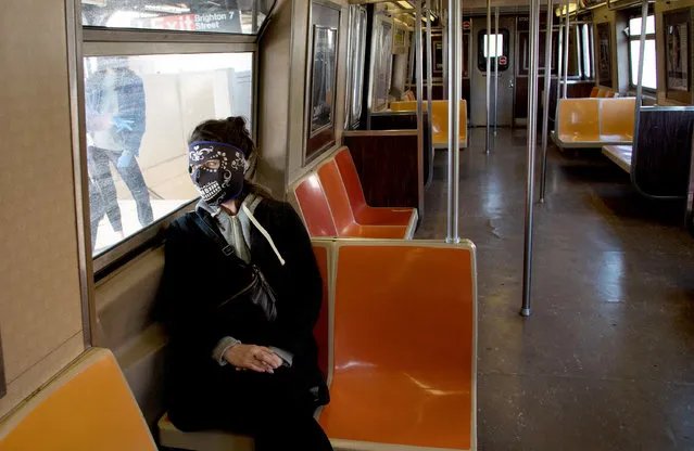 A woman wearing a mask in the NYC subway amid the coronavirus pandemic on May 22, 2020. Governor Cuomo of New York announced earlier this week that the state's beaches would open for Labor Day Weekend, however New York City beaches will still remain closed to bathing and gatherings, failure to comply would result in fencing to prevent people accessing them. (Photo by Braulio Jatar/SOPA Images/Rex Features/Shutterstock)