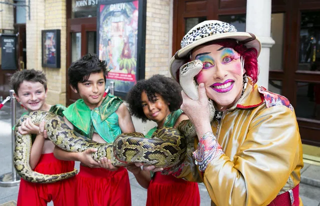 Jake Farmer (11), Lucas Mahon (9), and Ifraz Niazi (10) as Mowgli with Gaiety Panto Dame Joe Conlan as Nanny Nincompoop and Seamus is the green python at The Gaiety Theatre, Dublin on September 21, 2022 to mark the announcement that this years Panto will be Jungle Book. (Photo by Gareth Chaney/Collins Photos)