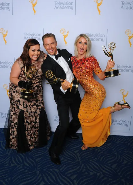 Tessandra Chavez, from left, Derek Hough and Julianne Hough, winners of the award for outstanding choreography for “Dancing With the Stars”, pose for a portrait at the Television Academy's Creative Arts Emmy Awards at Microsoft Theater on Saturday, September 12, 2015, in Los Angeles. (Photo by Vince Bucci/Invision for the Television Academy/AP Images)