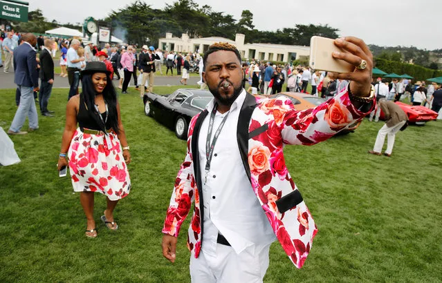 Tim and Ashley Banks take a selfie during the Concours d'Elegance in Pebble Beach, California, U.S. August 21, 2016. (Photo by Michael Fiala/Reuters/Courtesy of The Revs Institute)