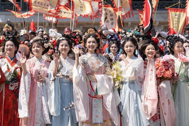 Performers in traditional Han costumes attend a flower goddess parade during a celebration for the Huazhao Festival at Daming Lake Scenic Area on March 29, 2025 in Jinan, Shandong Province of China. The 2025 Jinan Huazhao Festival kicked off along Daming Lake, the city's most iconic scenic area, on March 29, featuring various events such as a flower goddess parade, traditional Chinese performances, and a garden market. (Photo by VCG/VCG via Getty Images)