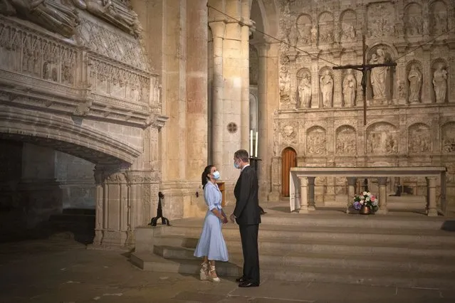 Spain's King Felipe VI and Queen Letizia visit the Royal Monastery of Poblet, northeastern Spain, Monday, July 20, 2020. Hundreds of Catalan independence supporters are protesting Monday the visit of King Felipe VI and Queen Letizia to the northeastern region as part of a royal tour across Spain that is meant to bolster spirits amid the coronavirus pandemic. The visit comes as a barrage of media leaks have revealed how the king's father, former monarch Juan Carlos I, allegedly hid millions of untaxed euros in offshore funds. (Photo by David Zorrakino/Europa Press via AP Photo)