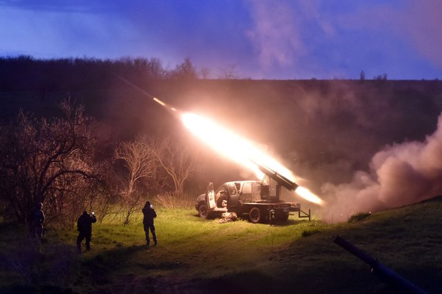 In this handout photograph taken on April 8, 2025 and released on April 9, 2025 by the press service of the 65th Mechanized Brigade of Ukrainian Armed Forces, Ukrainian servicemen fire a mobile MLRS (Multiple Launch Rocket System) at an undislosed location on the front line in Zaporizhzhia region, amid the Russian invasion of Ukraine. (Photo by Andriy Andriyenko/65th Mechanized Brigade of Ukrainian Armed Forces/AFP Photo)