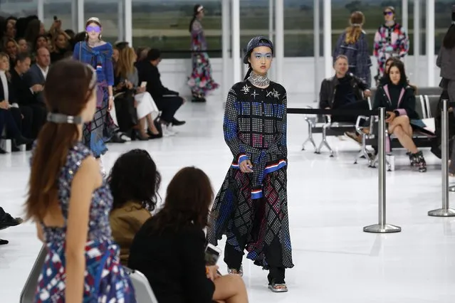 A model presents a creation by German designer Karl Lagerfeld as part of his Spring/Summer 2016 women's ready-to-wear collection for fashion house Chanel at the Grand Palais which is transformed into a Chanel airport during Fashion Week in Paris, France, October 6, 2015. (Photo by Benoit Tessier/Reuters)