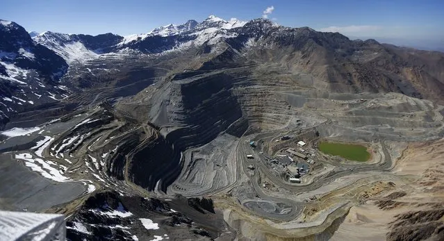 An aerial view of open pits of CODELCO's Andina (L) and Anglo American's Los Bronces (front) copper mines with Olivares glaciers in the background (top) at Los Andes Mountain range, near Santiago city, November 17, 2014. (Photo by Ivan Alvarado/Reuters)