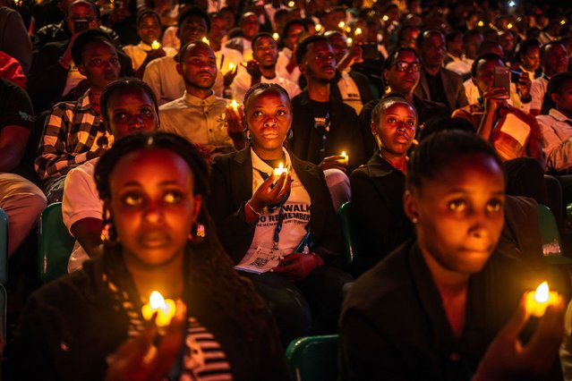 Young Rwandans hold flameless candles while taking part on a vigil during the commemorations of the 30th Anniversary of the 1994 Rwandan genocide at the BK Arena in Kigali on April 7, 2024. Rwanda on Sunday paid solemn tribute to genocide victims, 30 years after a vicious campaign orchestrated by Hutu extremists tore apart the country, as neighbours turned on each other in one of the bloodiest massacres of the 20th century. The killing spree, which lasted 100 days before the Rwandan Patriotic Front (RPF) rebel militia took Kigali in July 1994, claimed the lives of around 800,000 people, largely Tutsis but also moderate Hutus. (Photo by Luis Tato/AFP Photo)