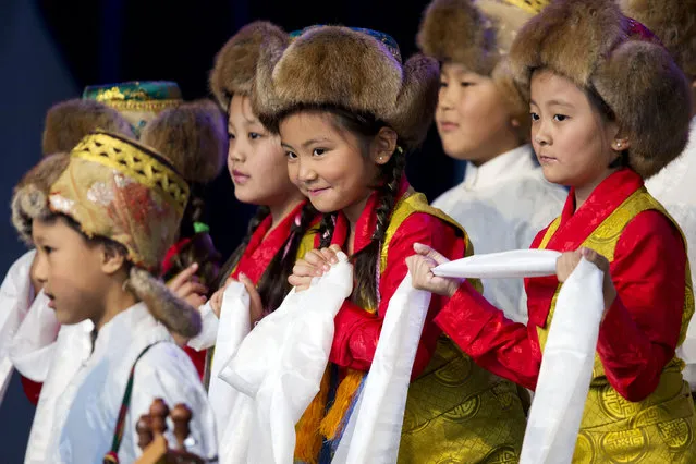 A Tibetan children's choir perform during the Liberty Medal ceremony at the National Constitution Center, Monday, October 26, 2015, in Philadelphia. The Dalai Lama, who canceled his public appearances this month because of health reasons is this year's recipient. The honor is given annually to an individual who displays courage and conviction while striving to secure liberty for people worldwide. (Photo by Matt Rourke/AP Photo)