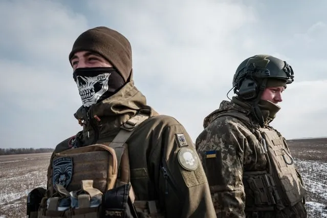 Ukrainian servicemen of the artillery unit of the 80th Air Assault Brigade stand near Bakhmut on February 7, 2023, amid the Russian invasion of Ukraine. (Photo by Yasuyoshi Chiba/AFP Photo)