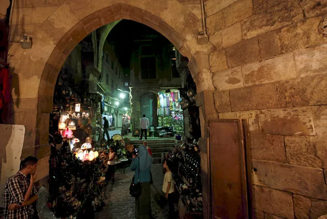 Vendors wait for customers in a popular tourist area named “Khan el-Khalili” at al-Hussein and Al-Azhar districts in old Islamic Cairo, Egypt August 18, 2016. Picture taken August 18, 2016. (Photo by Amr Abdallah Dalsh/Reuters)