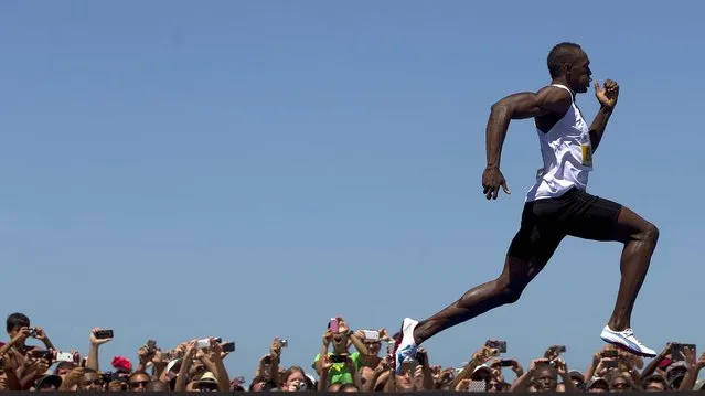 Jamaican Olympic gold medallist Usain Bolt wins the “Mano a Mano” men's 150m challenge on Copacabana beach in Rio de Janeiro, on March 31, 2013. Bolt defeated Antigua and Barbuda's Daniel Bailey, Ecuador's Alex Quinones and Brazil's Bruno Lins de Barros on a track specially built at the famous beach. (Photo by Felipe Dana/Associated Press)