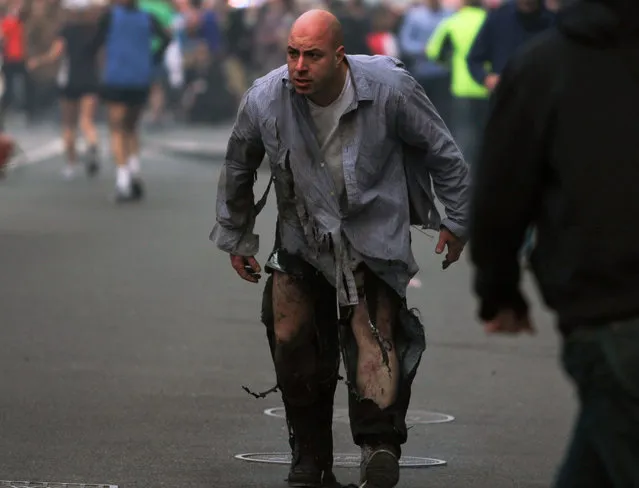 In this photo provided by The Daily Free Press and Kenshin Okubo, people react to an explosion at the 2013 Boston Marathon in Boston, Monday, April 15, 2013. (Photo by Kenshin Okubo/AP Photo/The Daily Free Press)