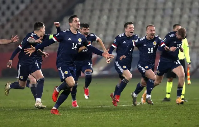 Scotland players celebrate their victory in the Euro 2020 playoff final soccer match between Serbia and Scotland, at the Rajko Mitic stadium in Belgrade, Serbia, Thursday, November 12, 2020. (Photo by Darko Vojinovic/AP Photo)