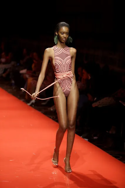 A model displays an outfit by designer Andrea Iyamah during the ARISE Fashion Week event in Lagos, Nigeria Saturday, March 31, 2018. (Photo by Sunday Alamba/AP Photo)