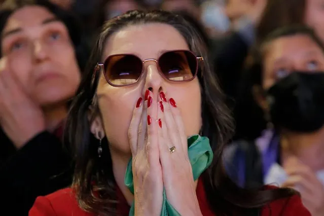 A supporter of Brazilian former President (2003-2010) and candidate for the leftist Workers Party (PT) Luiz Inacio Lula da Silva reacts as she watches the vote count of the legislative and presidential election, in Sao Paulo, Brazil, on October 2, 2022. Brazilians voted Sunday in a polarizing presidential election which front-runner Luiz Inacio Lula da Silva hopes to take in the first round as incumbent Jair Bolsonaro says he will accept the result if it is “clean”. (Photo by Caio Guatelli/AFP Photo)