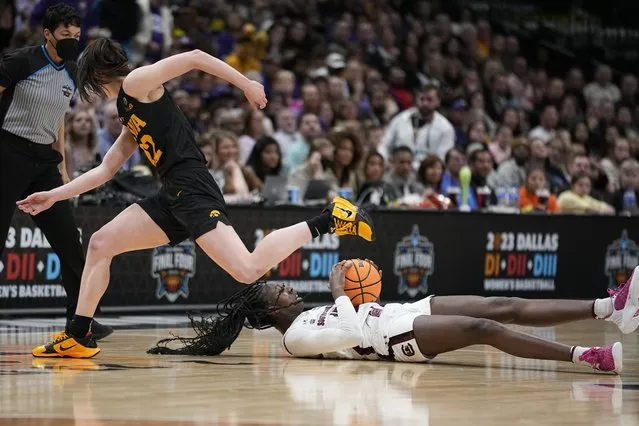 South Carolina's Laeticia Amihere steals the ball from Iowa's Caitlin Clark during the first half of an NCAA Women's Final Four semifinals basketball game Friday, March 31, 2023, in Dallas. (Photo by Tony Gutierrez/AP Photo)