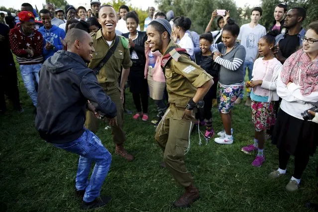 Members of the Ethiopian Jewish community in Israel dance during a ceremony marking the holiday of Sigd in Jerusalem November 11, 2015. (Photo by Amir Cohen/Reuters)