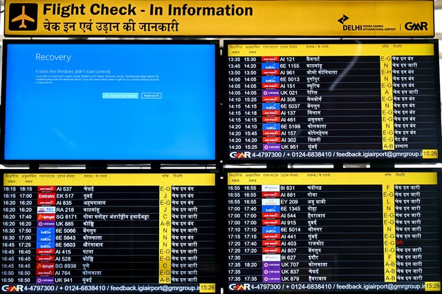 A display screen showing information on flights reflects an error message amid global IT outage at the Indira Gandhi International Airport in New Delhi on July 19, 2024. Five Indian airlines announced disruptions to their booking systems on July 19, matching widespread technical problems reported by flight operators around the world. (Photo by Money Sharma/AFP Photo)