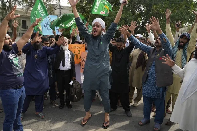 Supporters of a religious group “Tehreek-e-Labiak Pakistan” chant slogans during a rally against a woman who recently arrested in the blasphemy charges, in Lahore, Pakistan, Monday, April 17, 2023. Pakistani police arrested a Muslim woman on charges of blasphemy after she allegedly claimed she was an Islamic prophet. She was taken into custody from her home in the eastern Punjab province after a mob had gathered outside demanding that she be lynched after news spread of her alleged claims of prophethood. (Photo by K.M. Chaudary/AP Photo)
