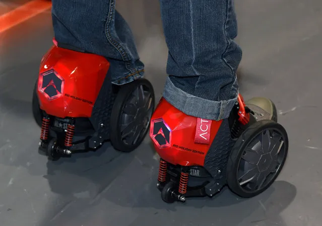 An attendee tries Acton's RocketSkates at the 2015 International CES at the Sands Expo and Convention Center on January 6, 2015 in Las Vegas, Nevada. The motorized skates that you strap to your shoes are powered by Lithium Ion batteries and can go up to 12 mph. (Photo by Ethan Miller/Getty Images)