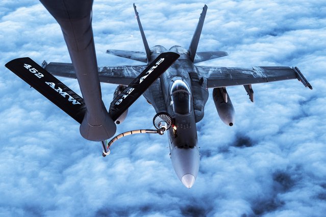 An Air Force KC-135 Stratotanker refuels a Canadian Air Force CF-18s over Alaska during Vigilant Shield 2017, a training exercise in the high Arctic. (Photo by Tech. Sgt. Gregory Brook)