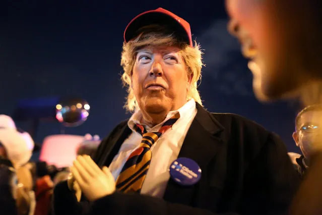 A man dresses as Republican presidential candidate Donald Trump with tiny hands, mocking a statement made by the candidate about the size of his anatomy, at the West Hollywood Halloween Carnaval in West Hollywood in Los Angeles, U.S., October 31, 2016. (Photo by David McNew/Reuters)