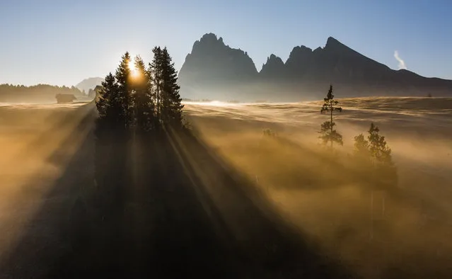 “Alpe di Siusi morning sun”. The photo was shot during a photo workshop that I was leading in the Dolomites in October 2011. We had a quite special morning with fog and a pretty blue sky. The sun was just over edge of the mountains (Sassolungo) and was shining through the fog and created rays. Location: Alpe di Siusi, Dolomites, Italy. (Photo and caption by Hans Kruse/National Geographic Traveler Photo Contest)